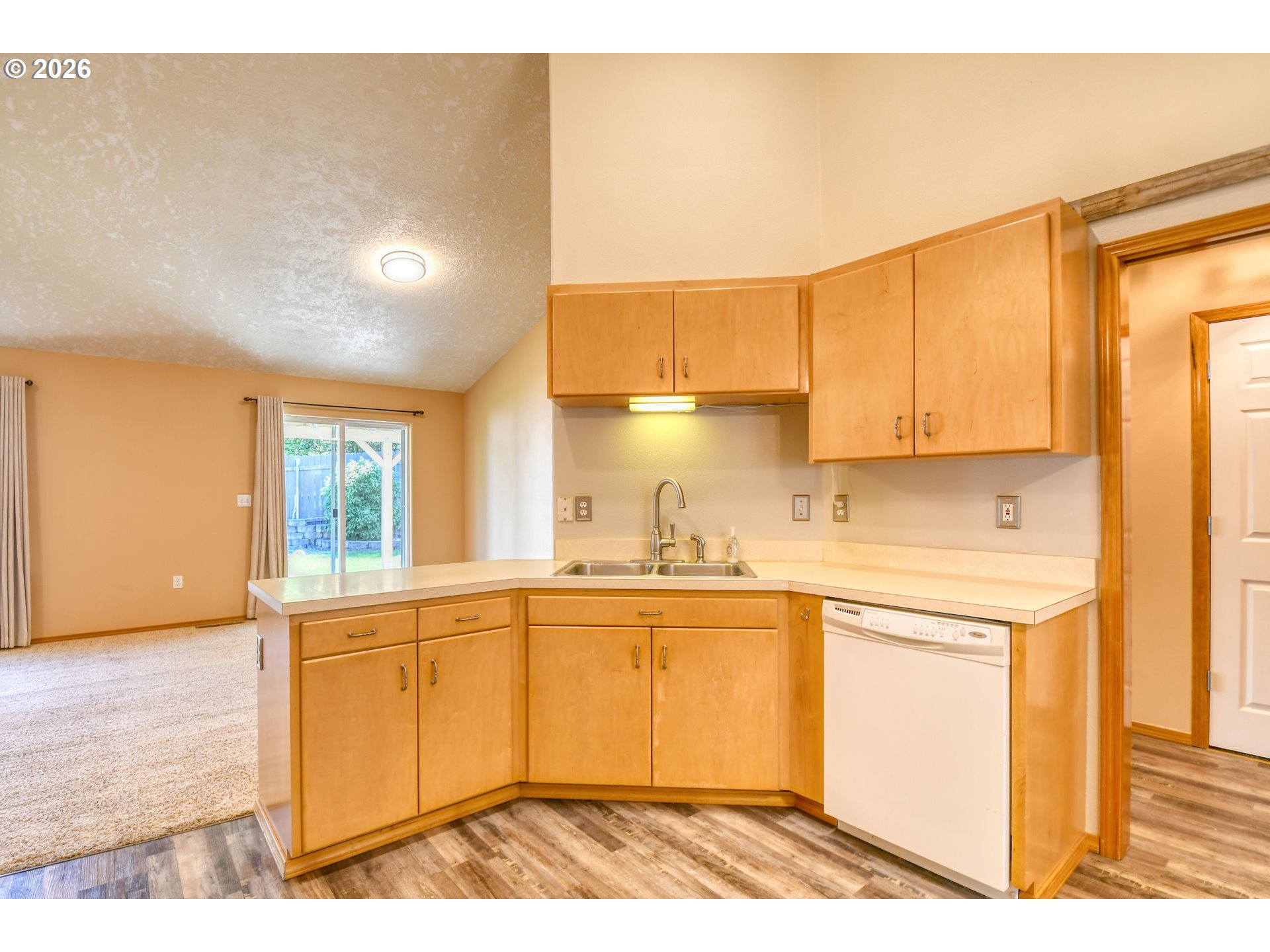 1614 Southwest 3rd Street Pendleton, OR 97801 - Photo 9 of 40 a kitchen with a sink a window and cabinets