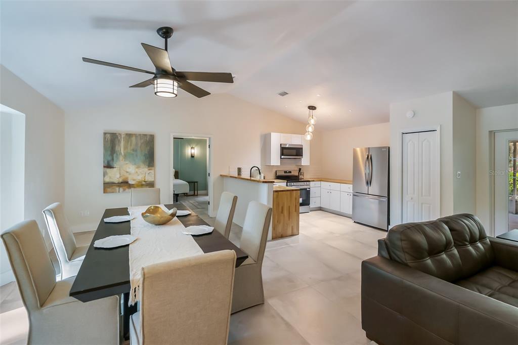 3222 Southwest 27th Street Gainesville, FL 32608 - Photo 13 of 42 a living room with furniture and kitchen view