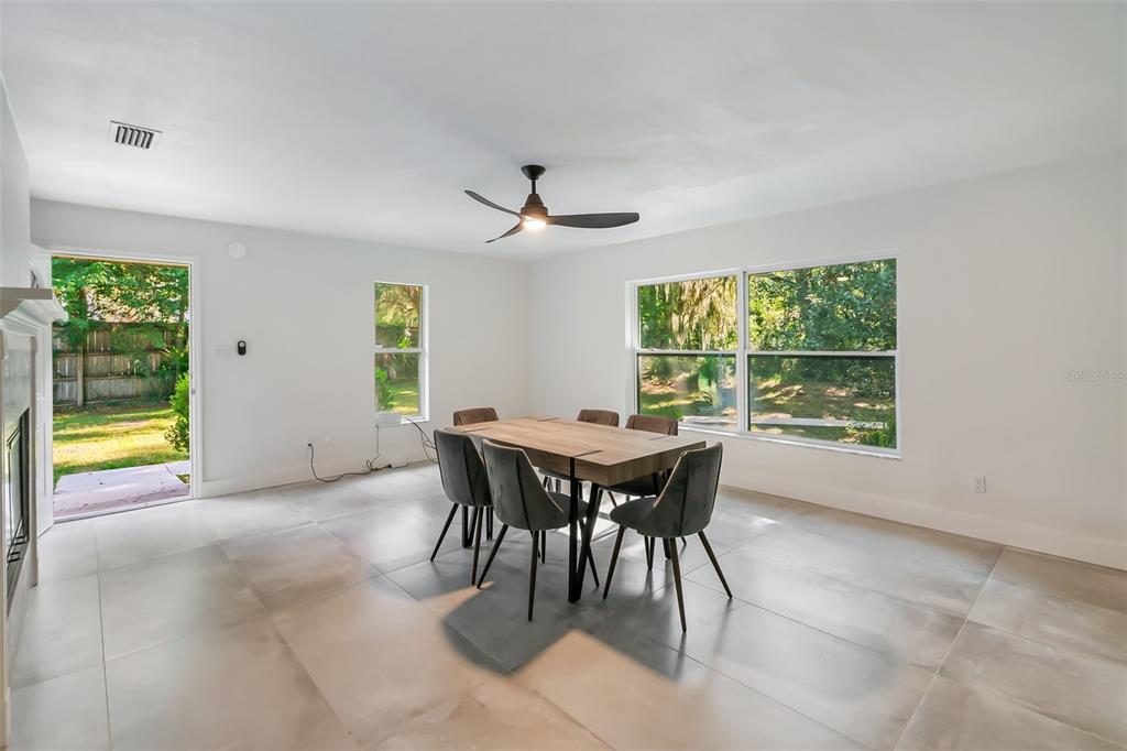 3222 Southwest 27th Street Gainesville, FL 32608 - Photo 16 of 42 a view of a dining room with furniture and a window