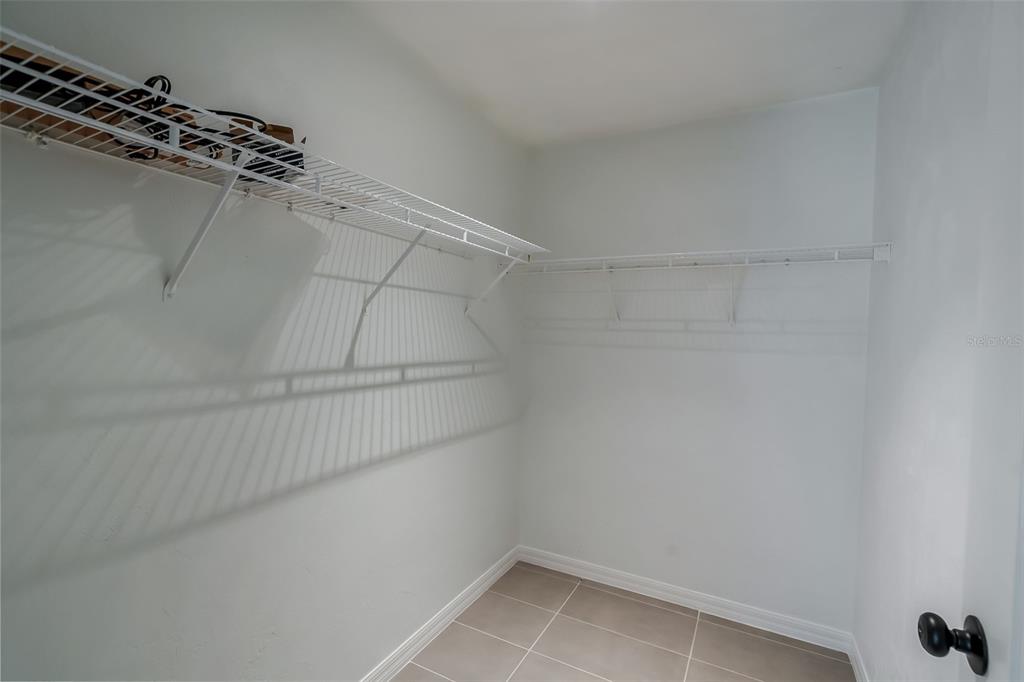 3222 Southwest 27th Street Gainesville, FL 32608 - Photo 20 of 42 a view of a room with racks on the wall