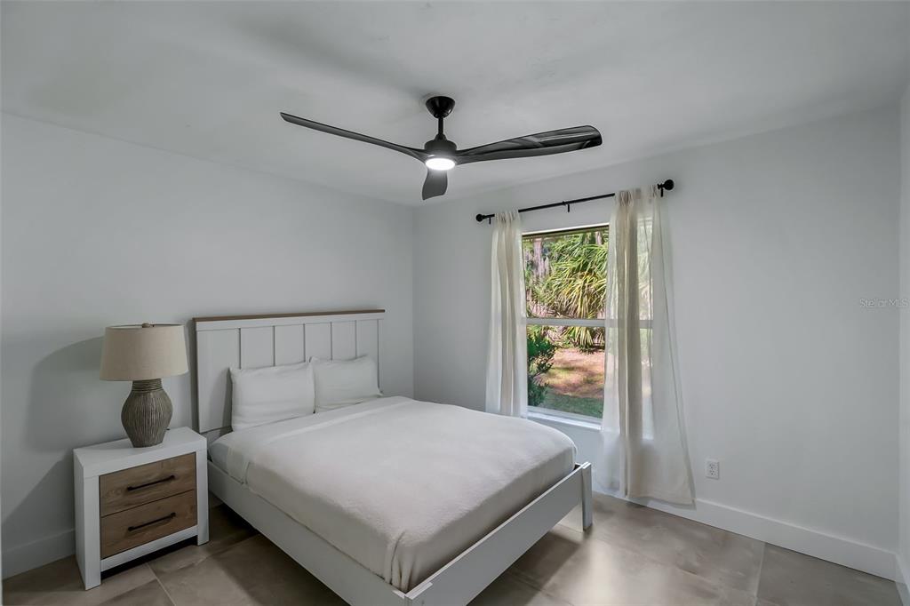 3222 Southwest 27th Street Gainesville, FL 32608 - Photo 23 of 42 a bedroom with a bed and a window