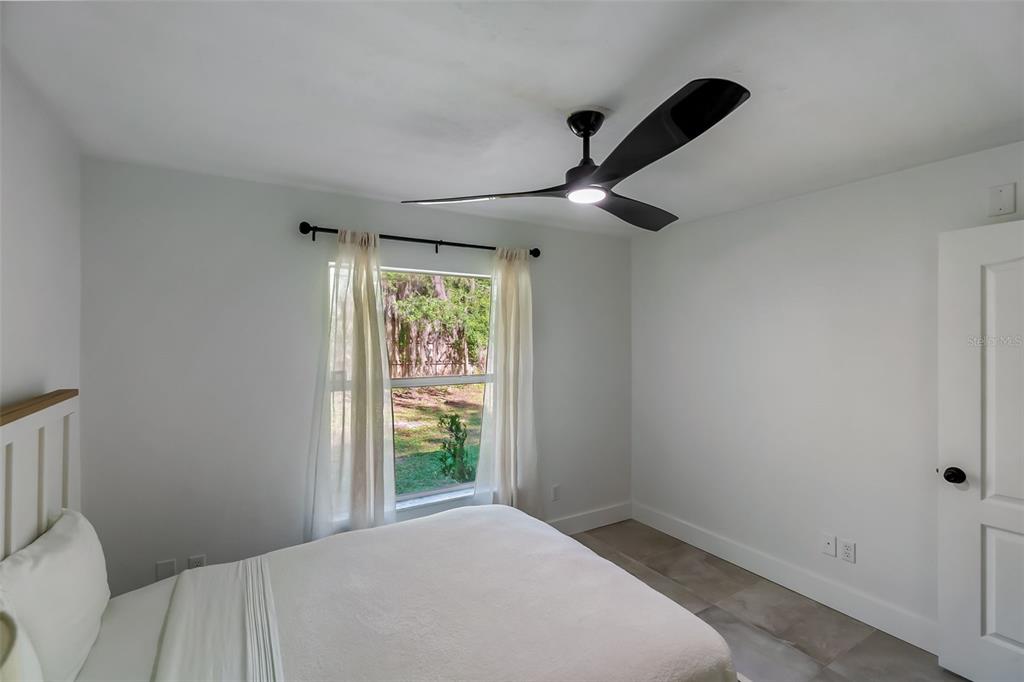3222 Southwest 27th Street Gainesville, FL 32608 - Photo 25 of 42 a bedroom with a bed and a window