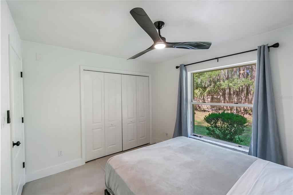 3222 Southwest 27th Street Gainesville, FL 32608 - Photo 28 of 42 a view of a livingroom with a ceiling fan and window