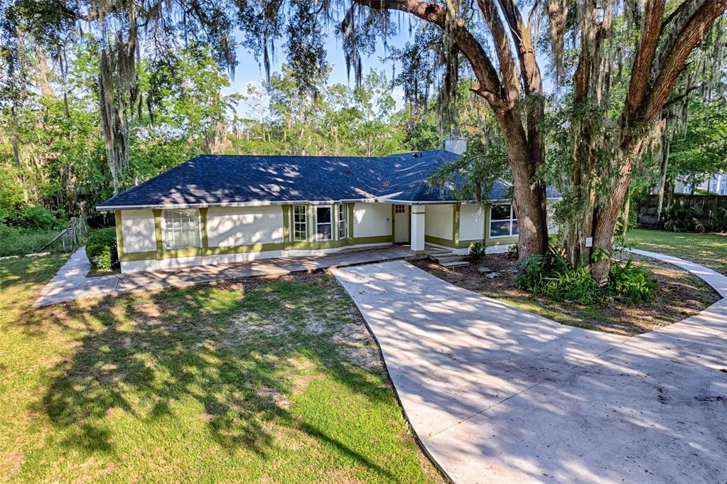 3222 Southwest 27th Street Gainesville, FL 32608 - Photo 35 of 42 a front view of a house with a yard