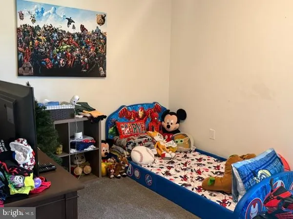 a room with toys and next to a wall