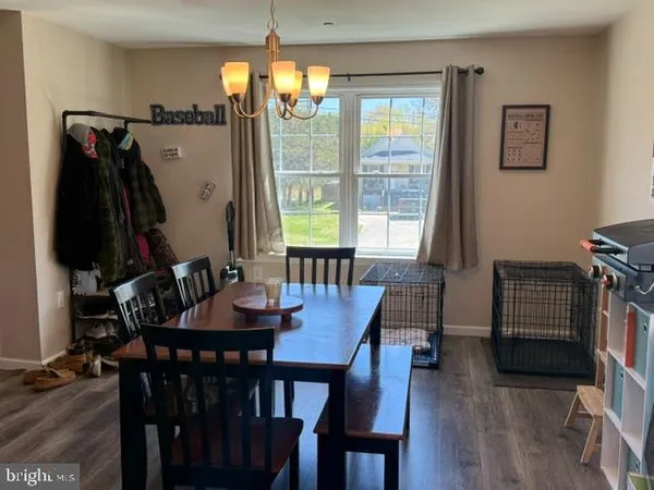 a view of a dining room with furniture and window