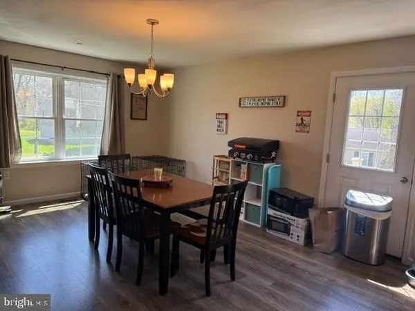 a dining room with furniture window wooden floor