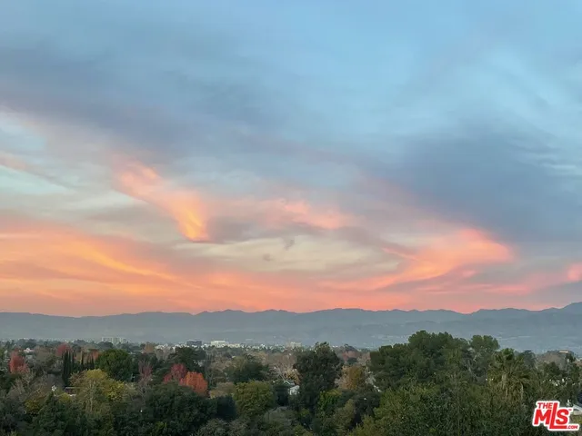 a view of a city and mountains in the background