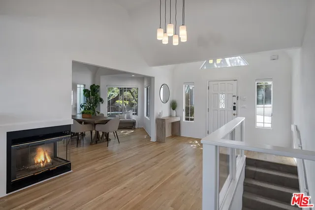 a view of a livingroom with furniture and a fireplace