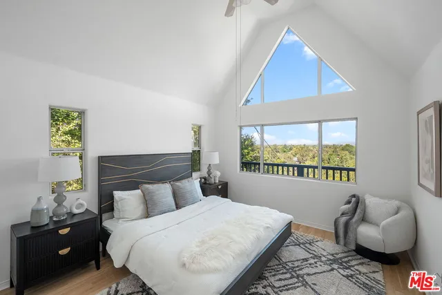 a bed room with a bed and a chair