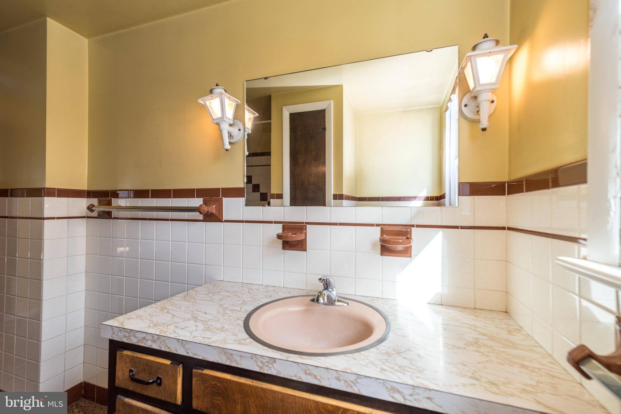 1962 Kepler Road Pottstown, PA 19464 - Photo 14 of 26 a bathroom with a sink and a mirror