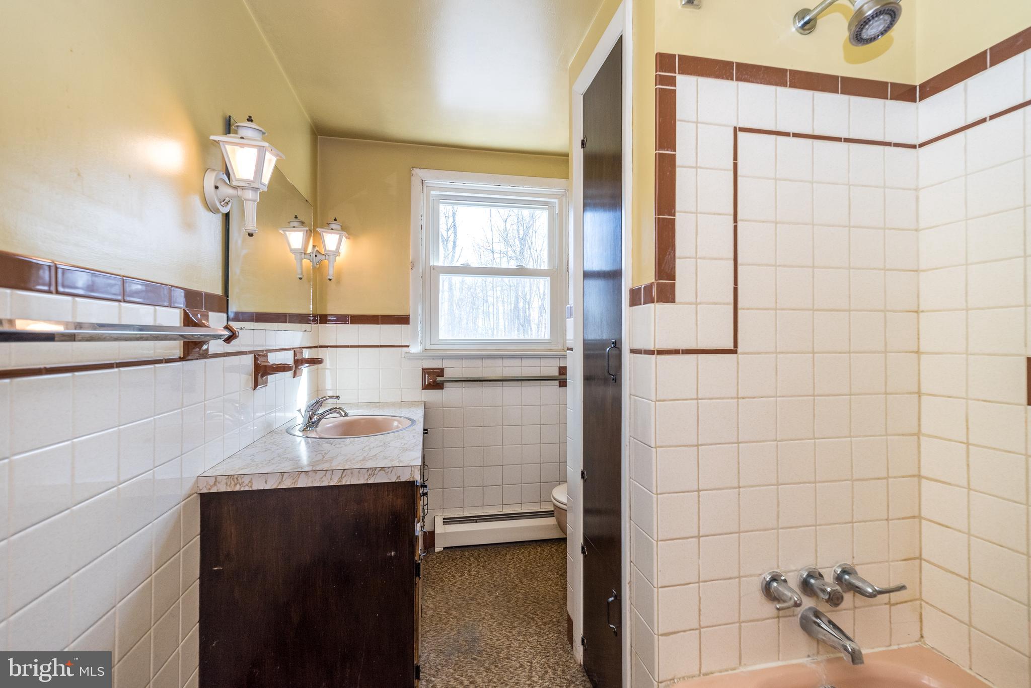 1962 Kepler Road Pottstown, PA 19464 - Photo 15 of 26 a bathroom with a sink and a mirror