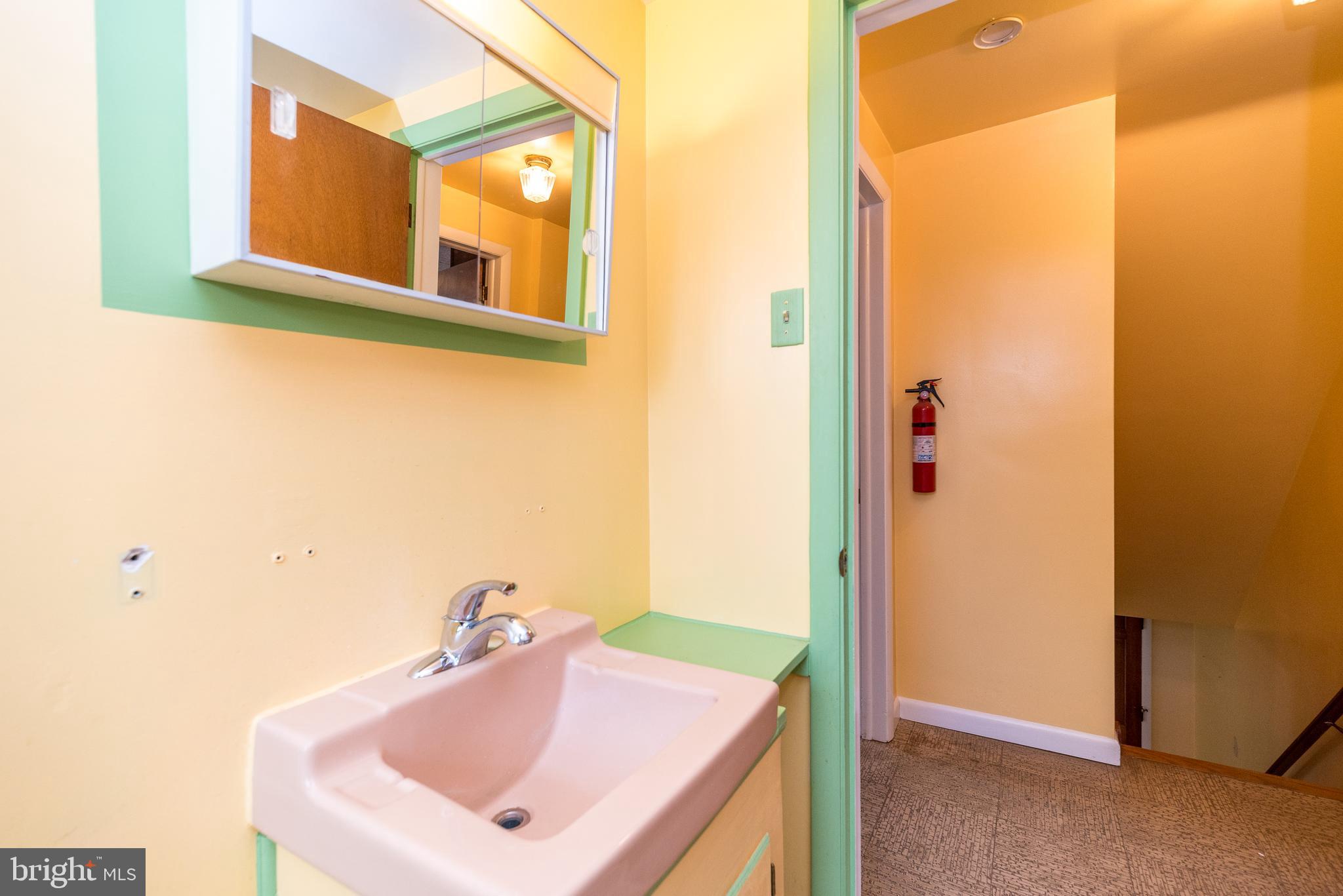 1962 Kepler Road Pottstown, PA 19464 - Photo 24 of 26 a bathroom with a sink and a mirror