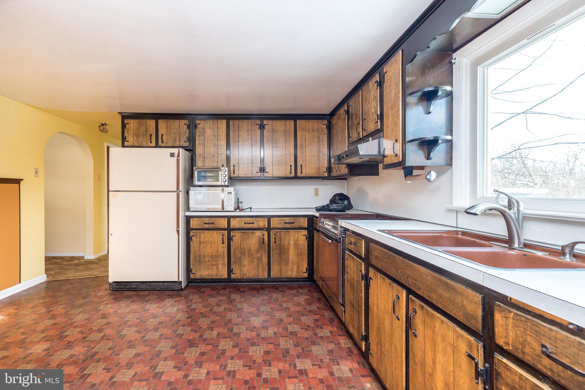 1962 Kepler Road Pottstown, PA 19464 - Photo 8 of 26 a kitchen with a refrigerator and a sink