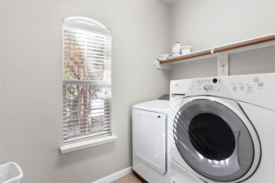 30 Supiro Drive Manvel, TX 77578 - Photo 11 of 30 a close view of a utility room with dryer and washer