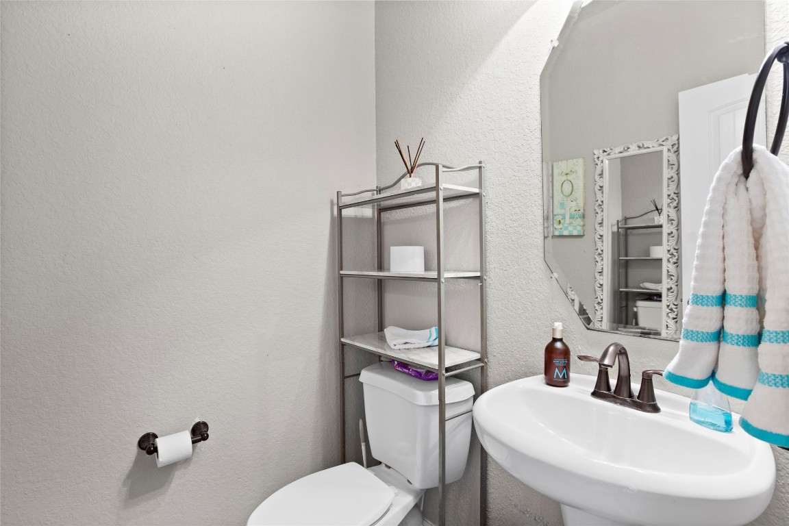 30 Supiro Drive Manvel, TX 77578 - Photo 12 of 30 a bathroom with a toilet a sink and mirror