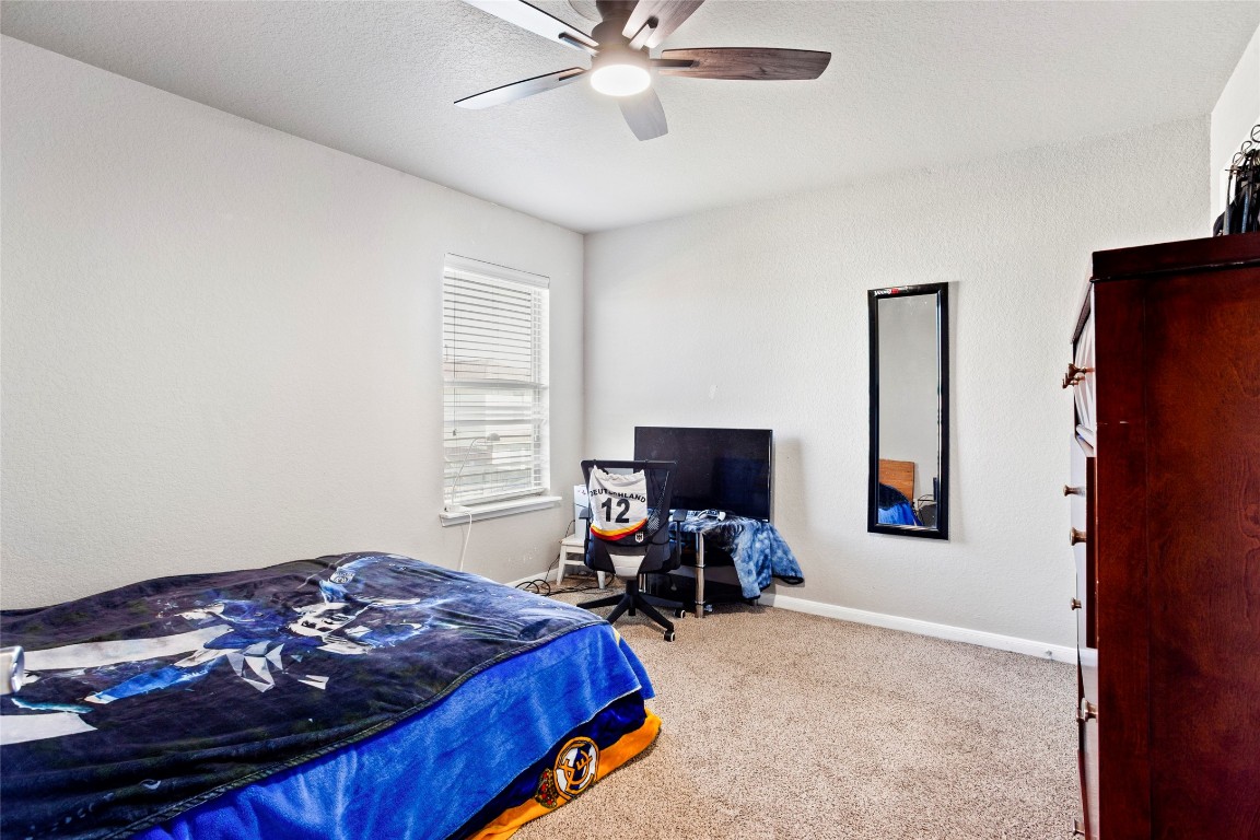 30 Supiro Drive Manvel, TX 77578 - Photo 21 of 30 a bedroom with a bed and flat screen tv