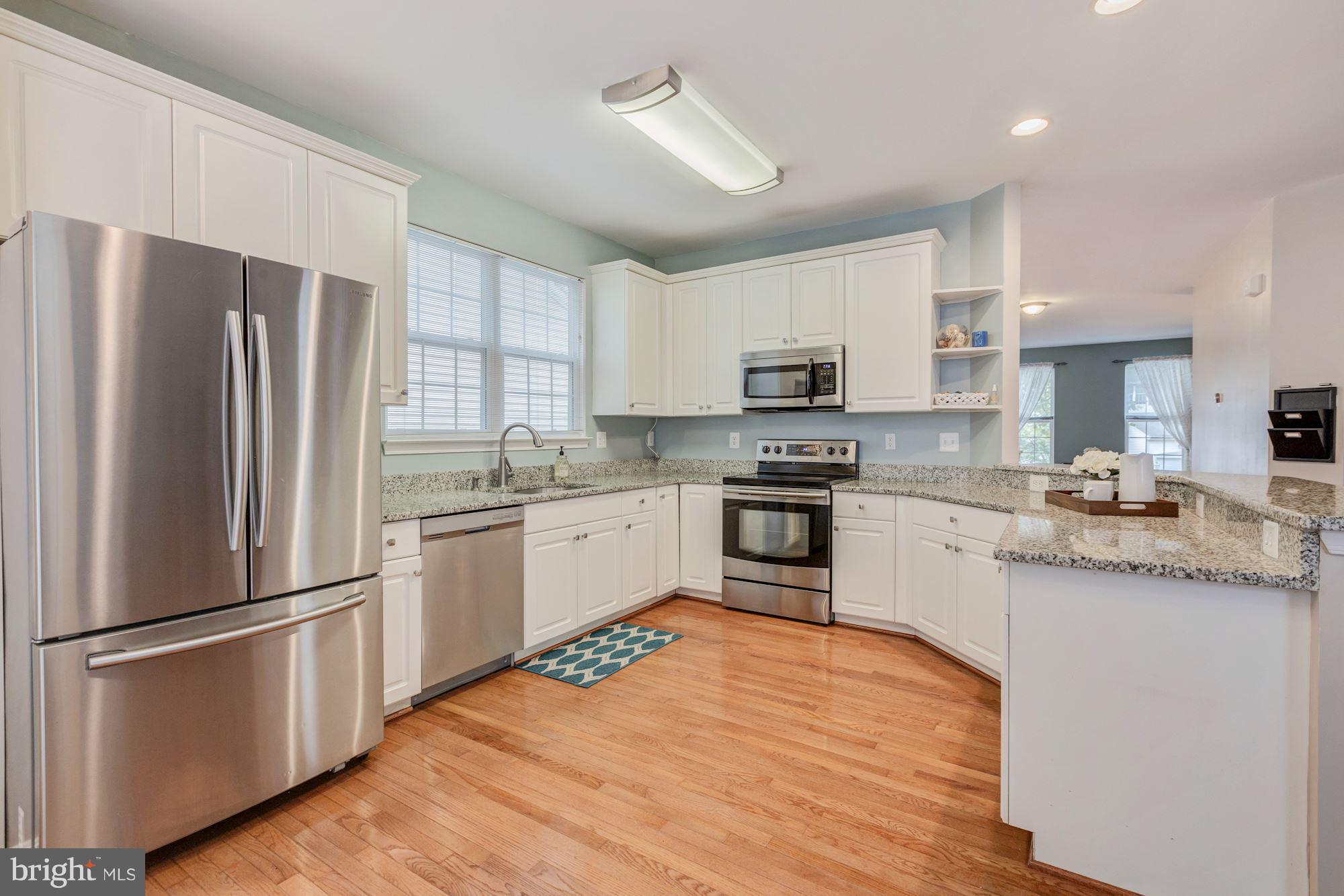 8769 Partridge Run Way Bristow, VA 20136 - Photo 7 of 29 Stainless steel appliances and granite countertops