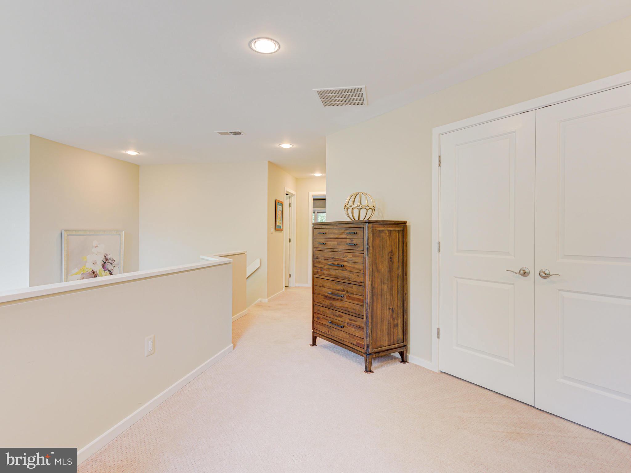 1422 Belcastle Court Reston, VA 20194 - Photo 53 of 85 Upper level landing looks over the living room
