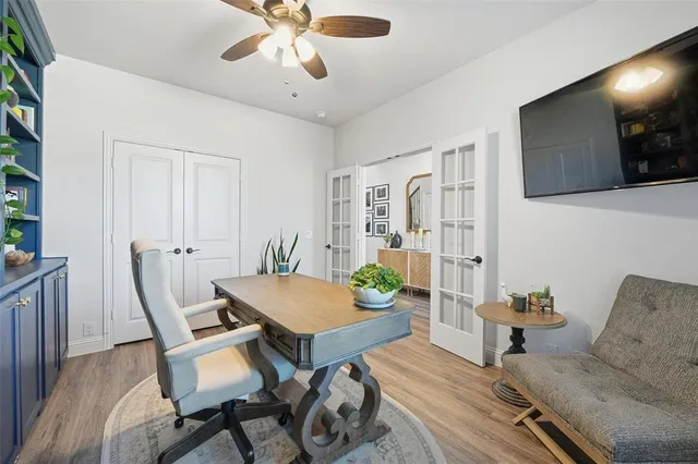 a workspace with furniture and wooden floor