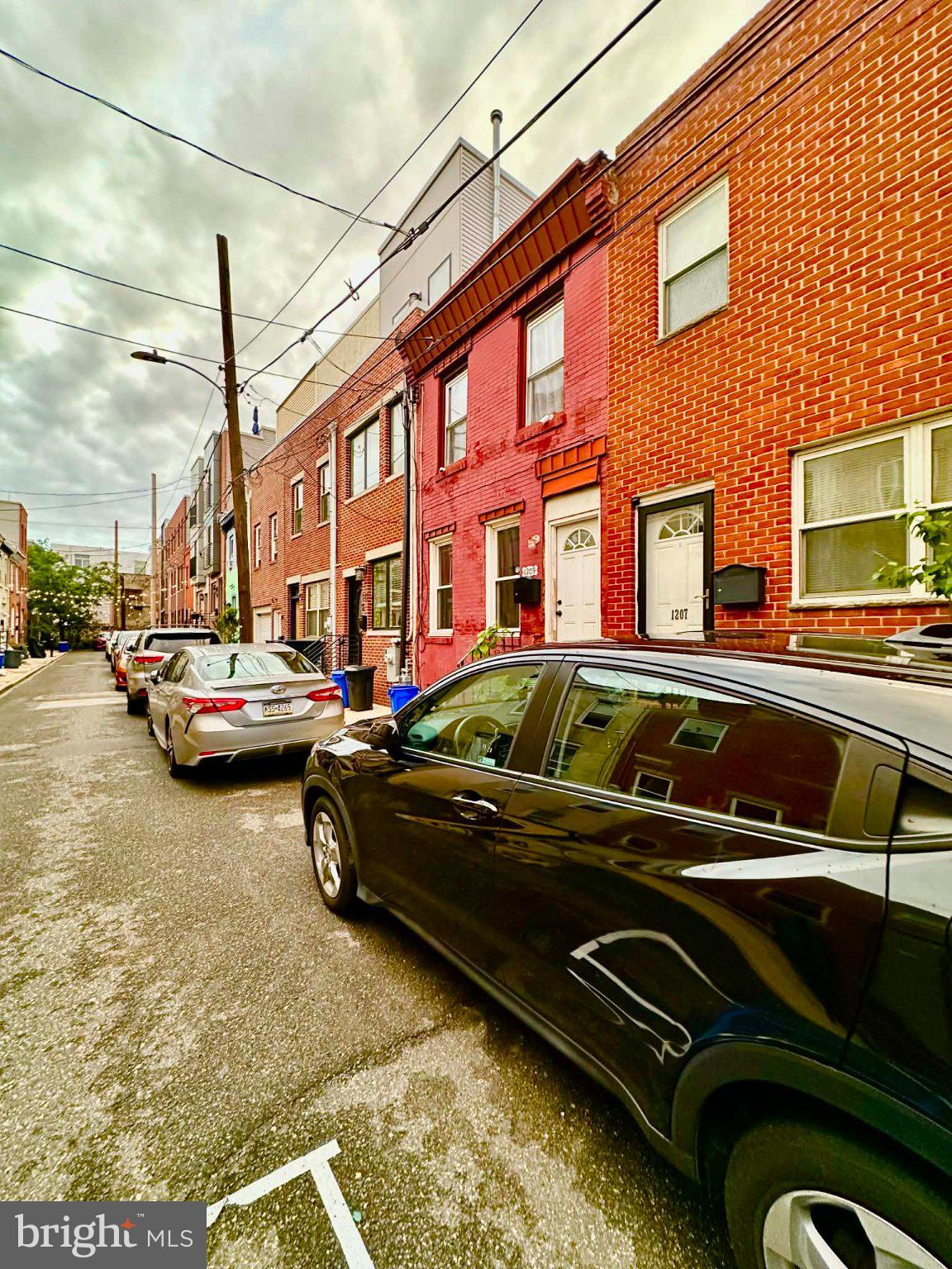 1209 Peters Street Philadelphia, PA 19147 - Photo 12 of 13 Charming street with vibrant facades.