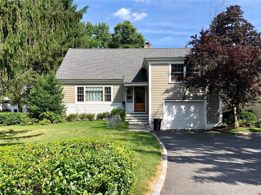 19 Rickbern Street Rye, NY 10580 - Photo 1 of 1 a front view of a house with a garden