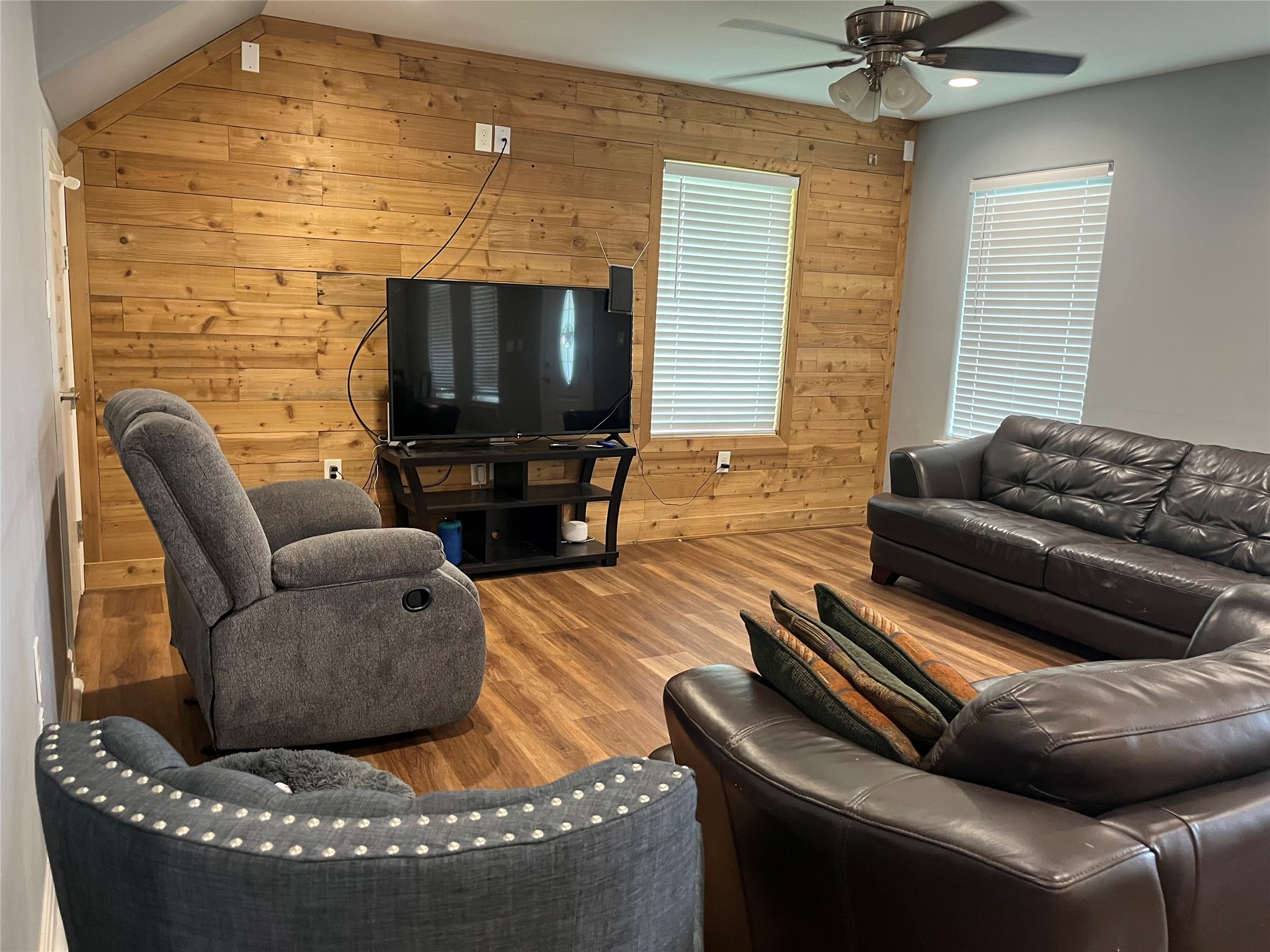 21511 Rio Villa Drive Houston, TX 77049 - Photo 32 of 45 a living room with furniture and a flat screen tv