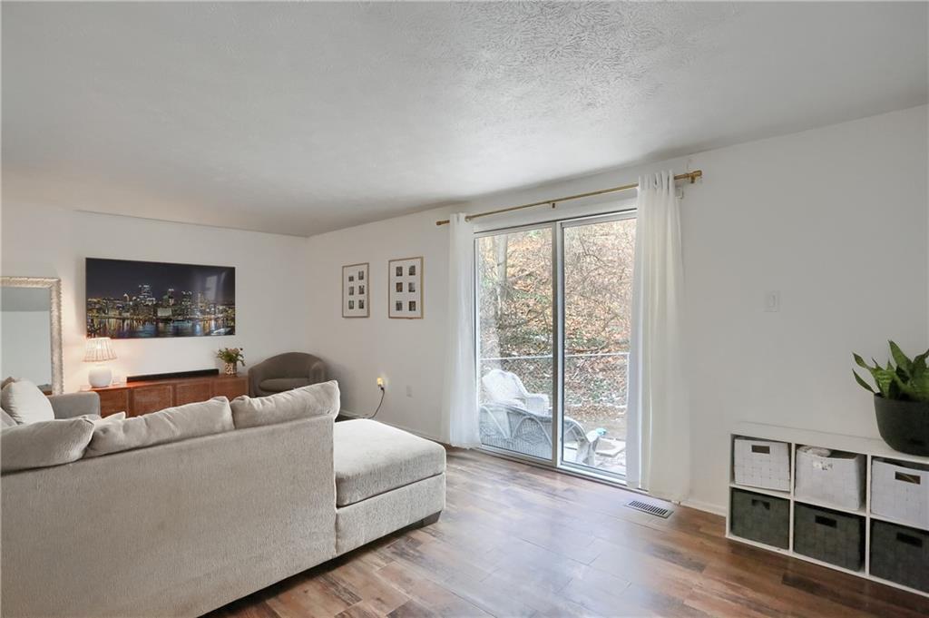 582 Broadhead Avenue Pittsburgh, PA 15205 - Photo 11 of 24 a living room with furniture and a window