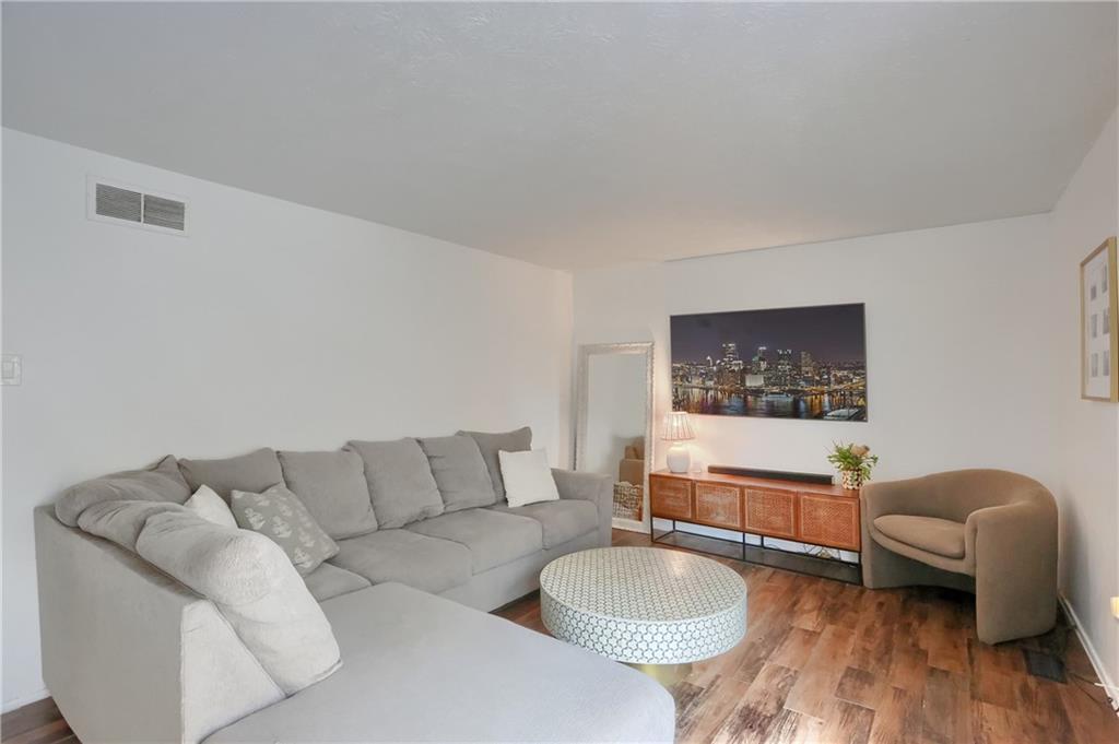 582 Broadhead Avenue Pittsburgh, PA 15205 - Photo 12 of 24 a living room with furniture and a wooden floor