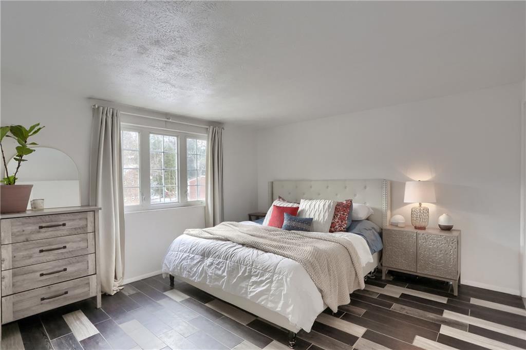 582 Broadhead Avenue Pittsburgh, PA 15205 - Photo 17 of 24 a bedroom with a bed and a dresser