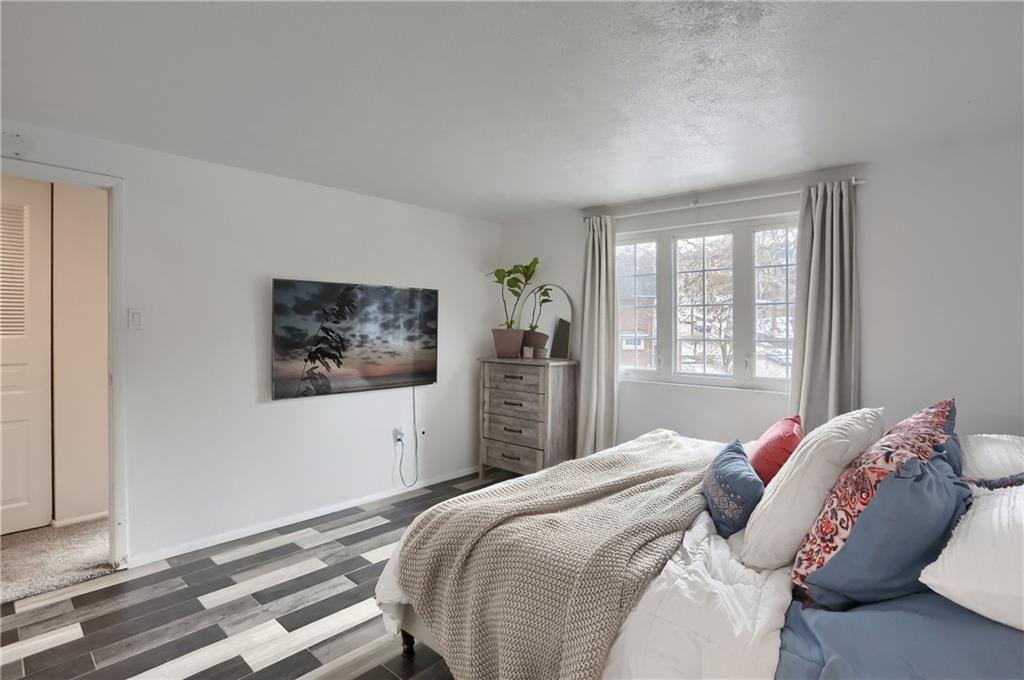 582 Broadhead Avenue Pittsburgh, PA 15205 - Photo 18 of 24 a bedroom with a large bed and a window