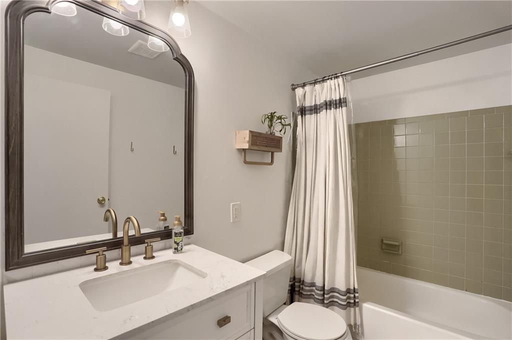 582 Broadhead Avenue Pittsburgh, PA 15205 - Photo 19 of 24 a bathroom with a sink a toilet a mirror and shower