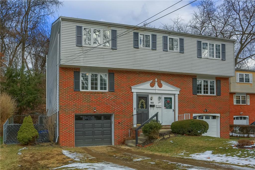 582 Broadhead Avenue Pittsburgh, PA 15205 - Photo 2 of 24 a front view of a house with a yard