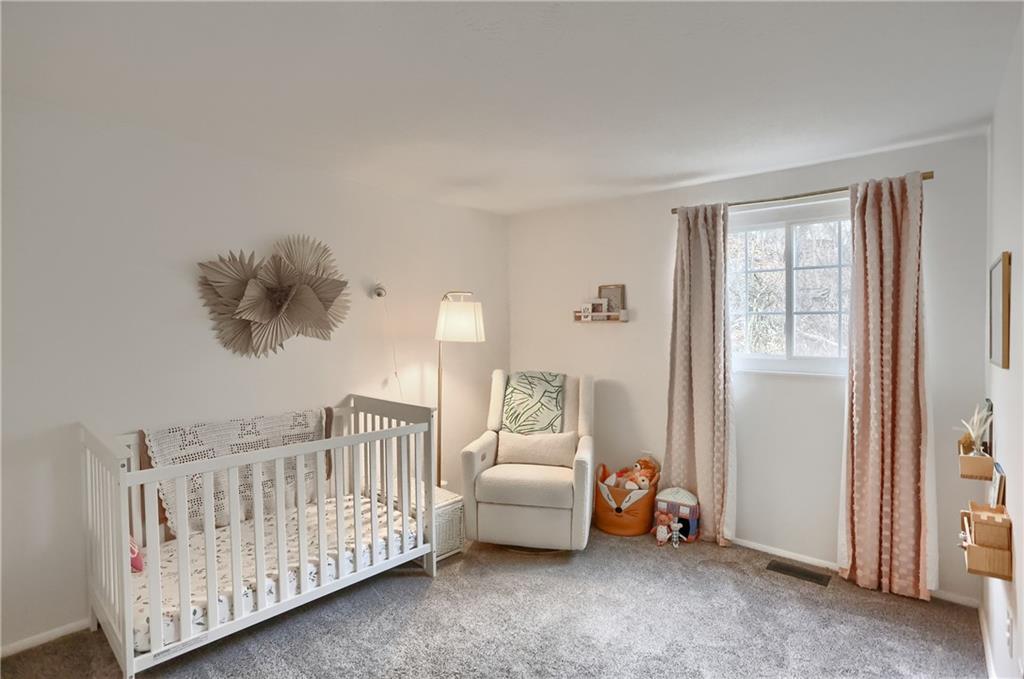582 Broadhead Avenue Pittsburgh, PA 15205 - Photo 22 of 24 a bedroom with furniture and a window