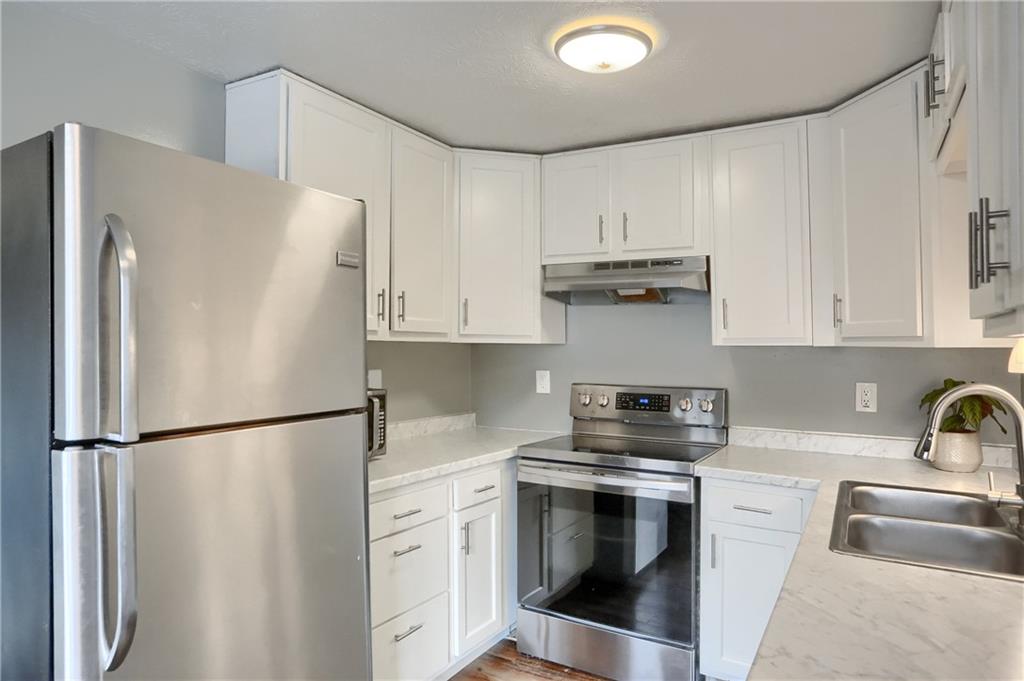 582 Broadhead Avenue Pittsburgh, PA 15205 - Photo 7 of 24 a kitchen with stainless steel appliances a refrigerator sink and cabinets