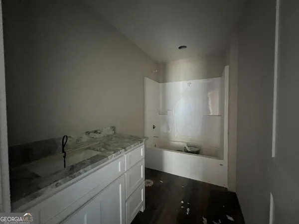 a bathroom with a sink and mirror