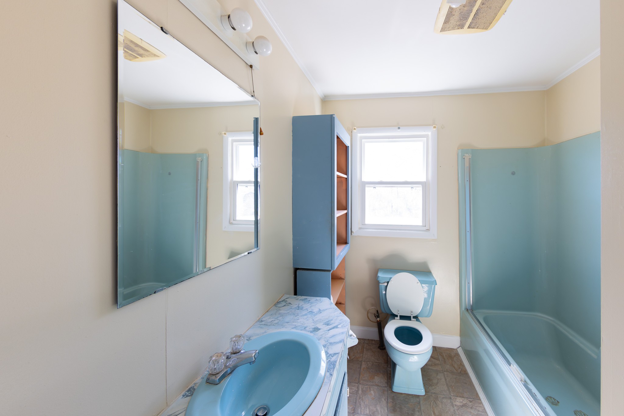674 Switzerland Road Hohenwald, TN 38462 - Photo 20 of 38 a bathroom with a granite countertop sink mirror vanity and toilet