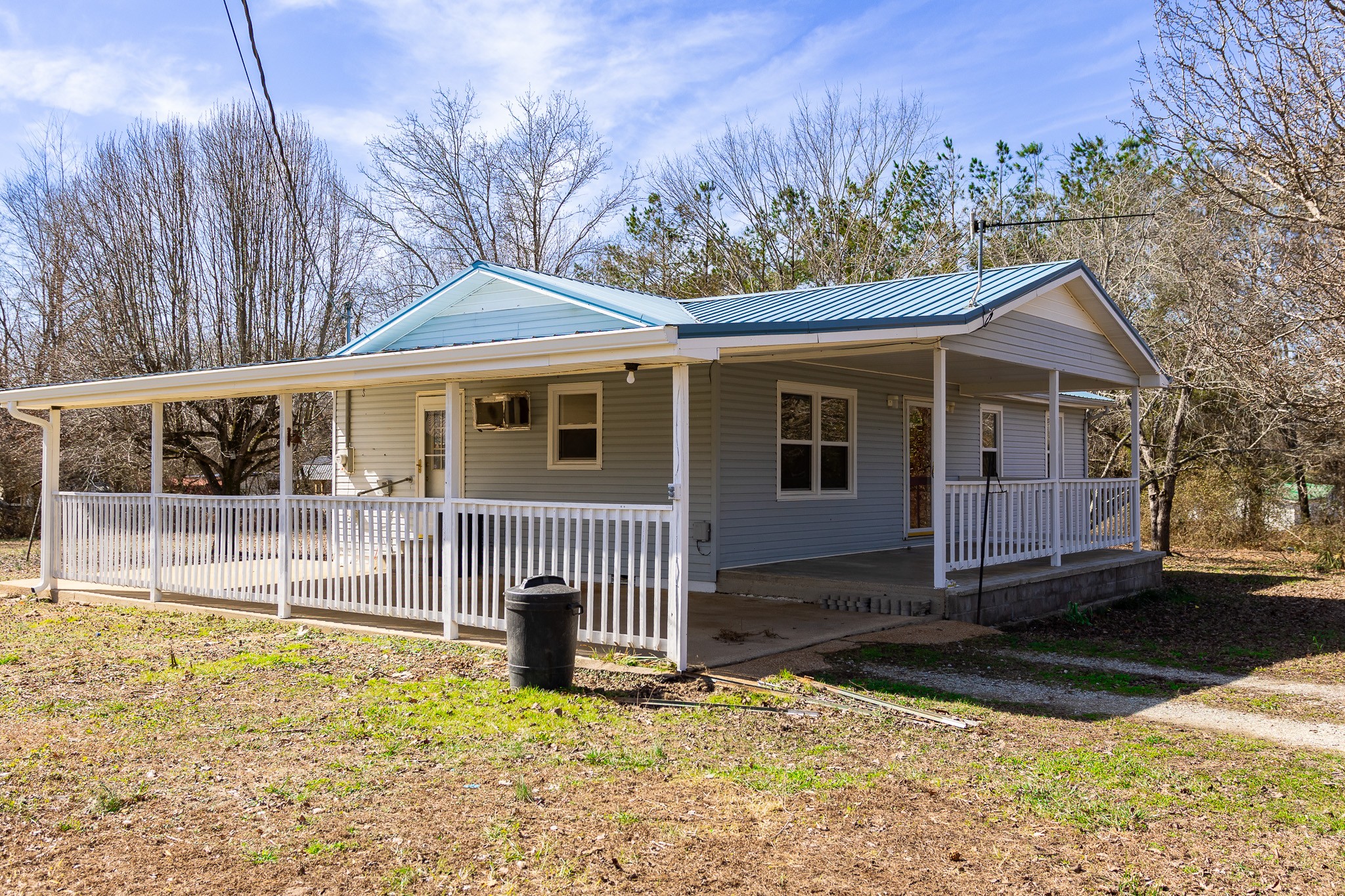 674 Switzerland Road Hohenwald, TN 38462 - Photo 2 of 38 a view of a house with a yard