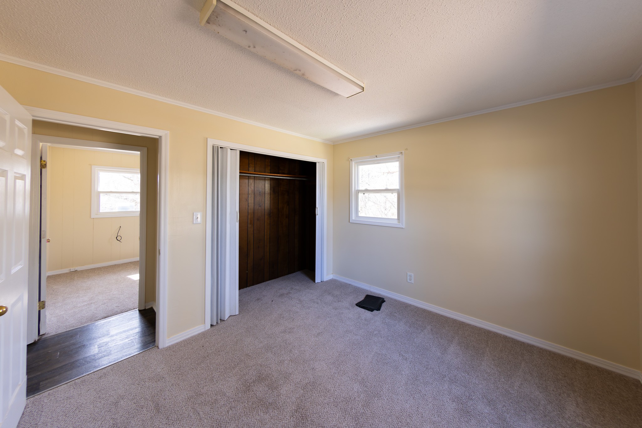 674 Switzerland Road Hohenwald, TN 38462 - Photo 22 of 38 an empty room with windows and closet