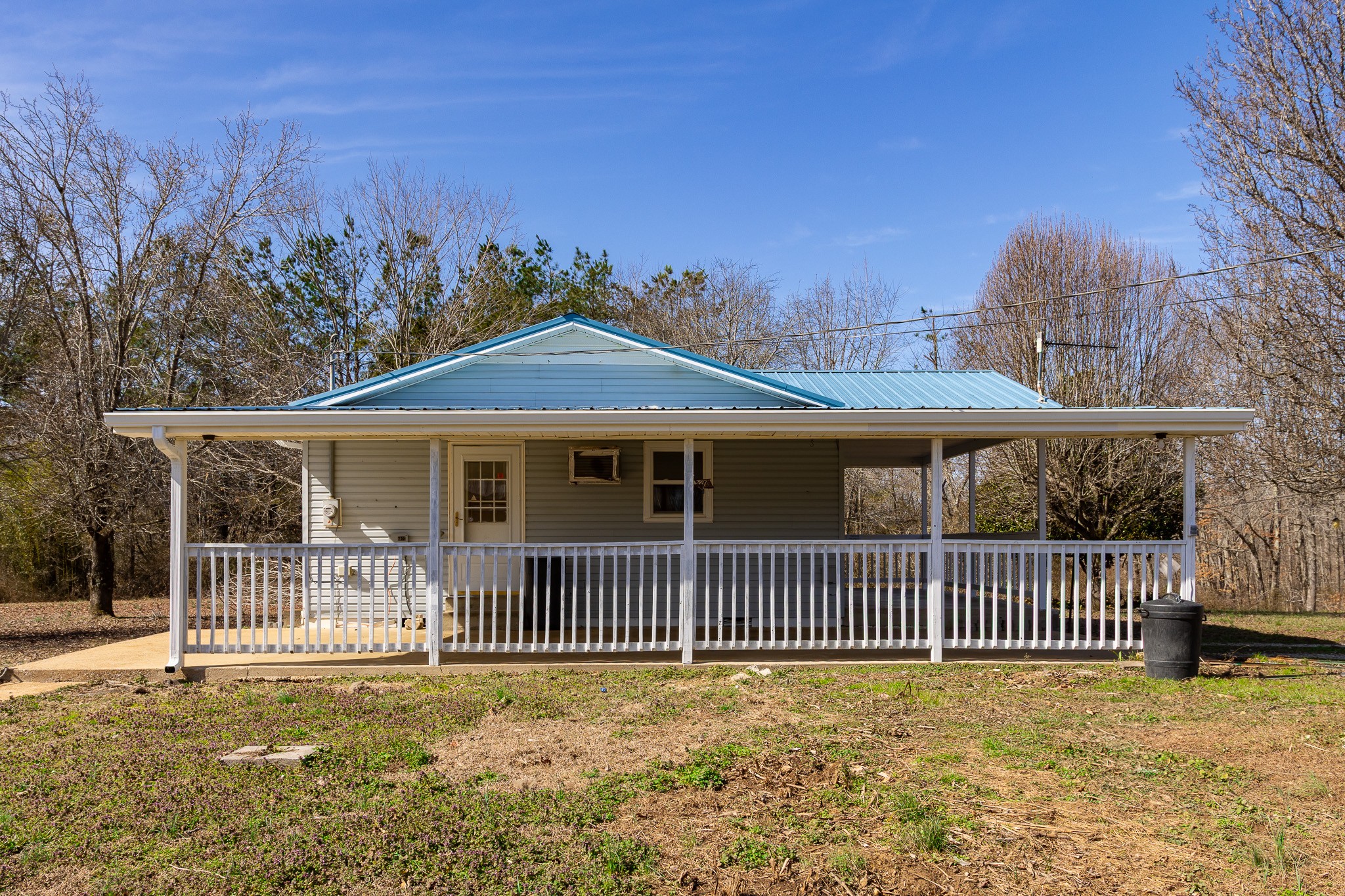 674 Switzerland Road Hohenwald, TN 38462 - Photo 3 of 38 a front view of a house with a garden