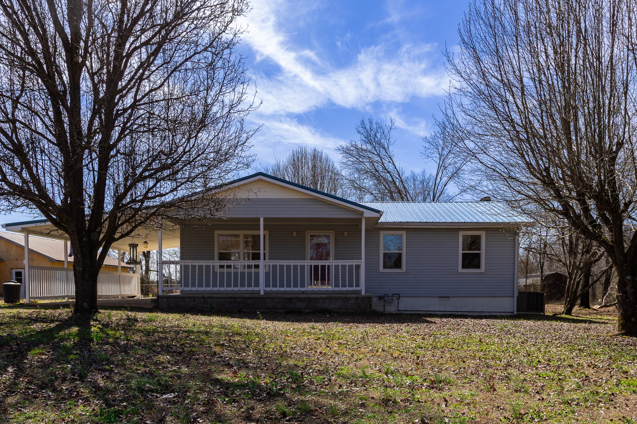 674 Switzerland Road Hohenwald, TN 38462 - Photo 7 of 38 a front view of a house with garden
