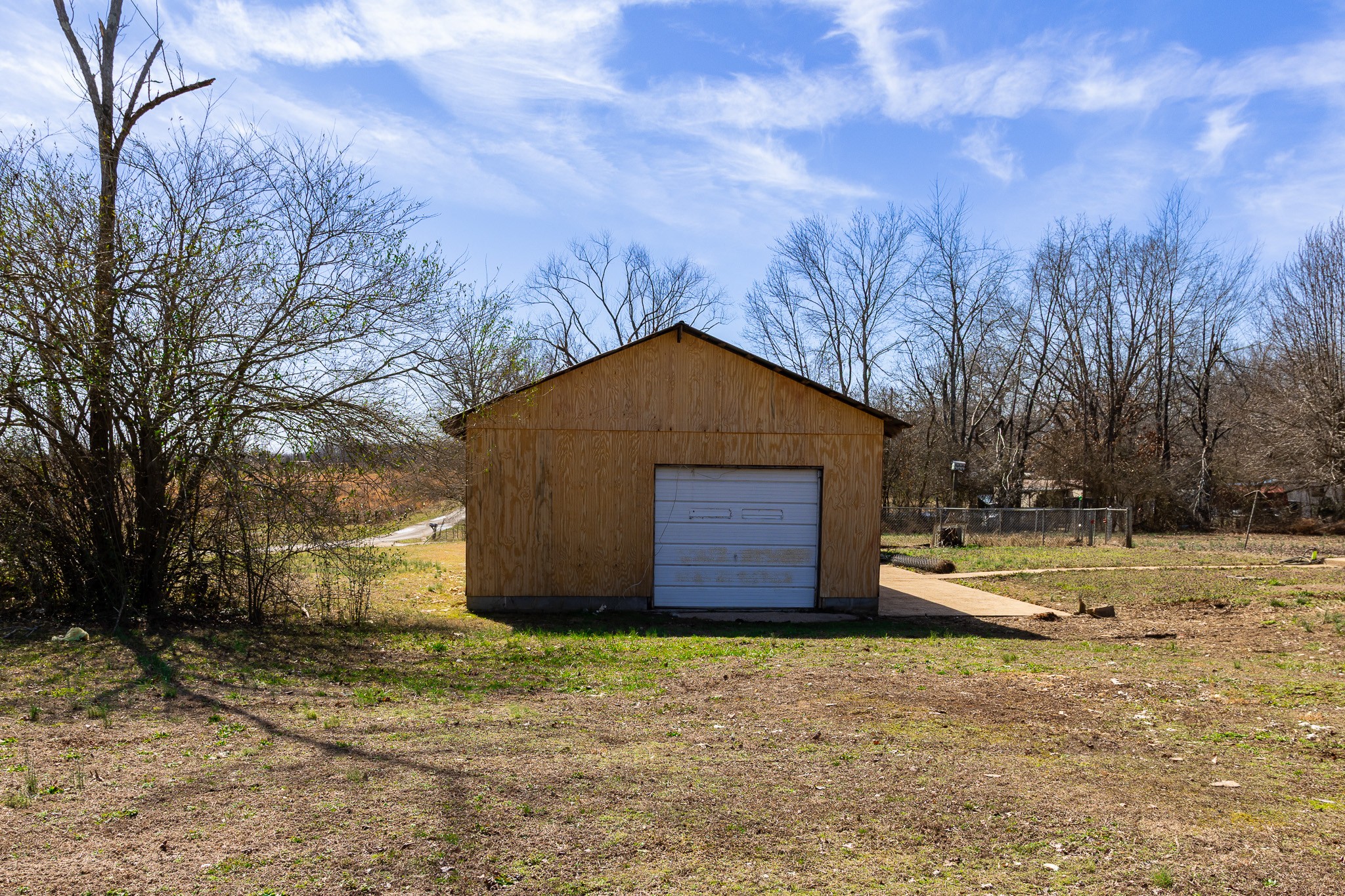 674 Switzerland Road Hohenwald, TN 38462 - Photo 8 of 38 a house with trees in front of it