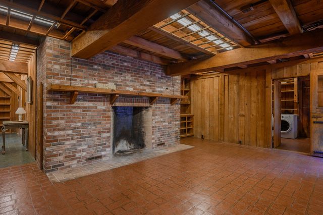 a view of a room with wooden walls