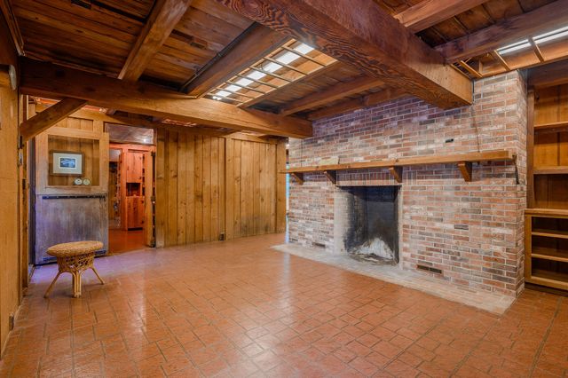 a view of an empty room with a fireplace