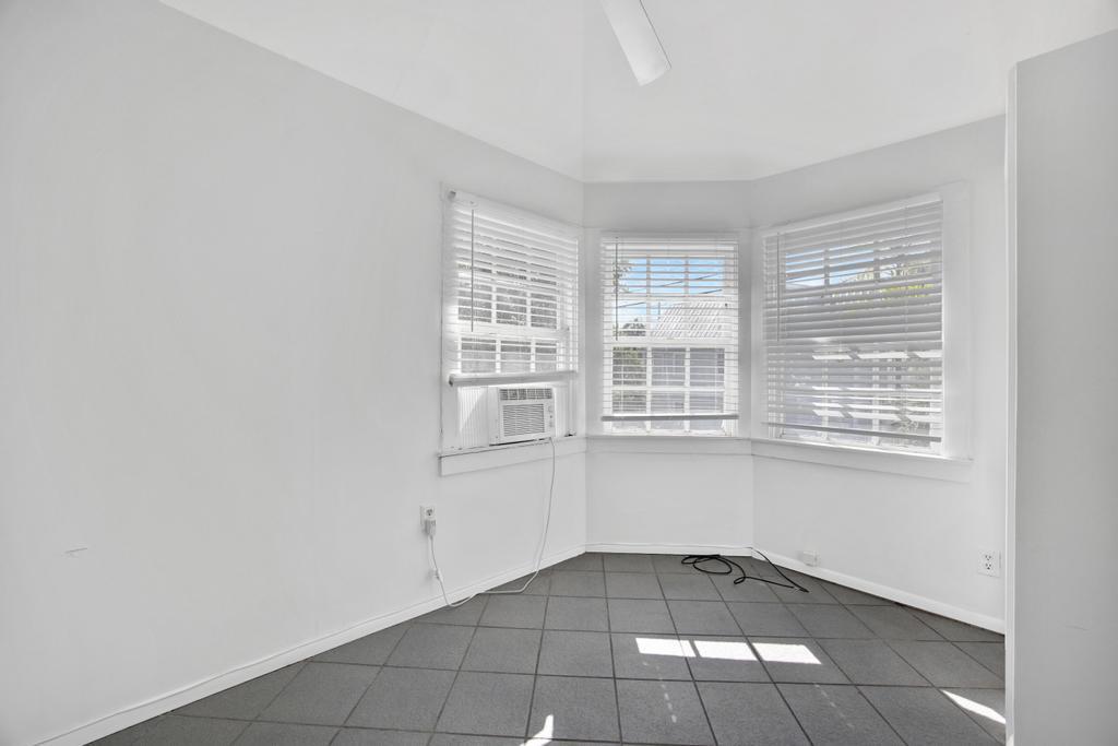 623 Thomas Street, Unit C Key West, FL 33040 - Photo 11 of 25 a view of an empty room with a window