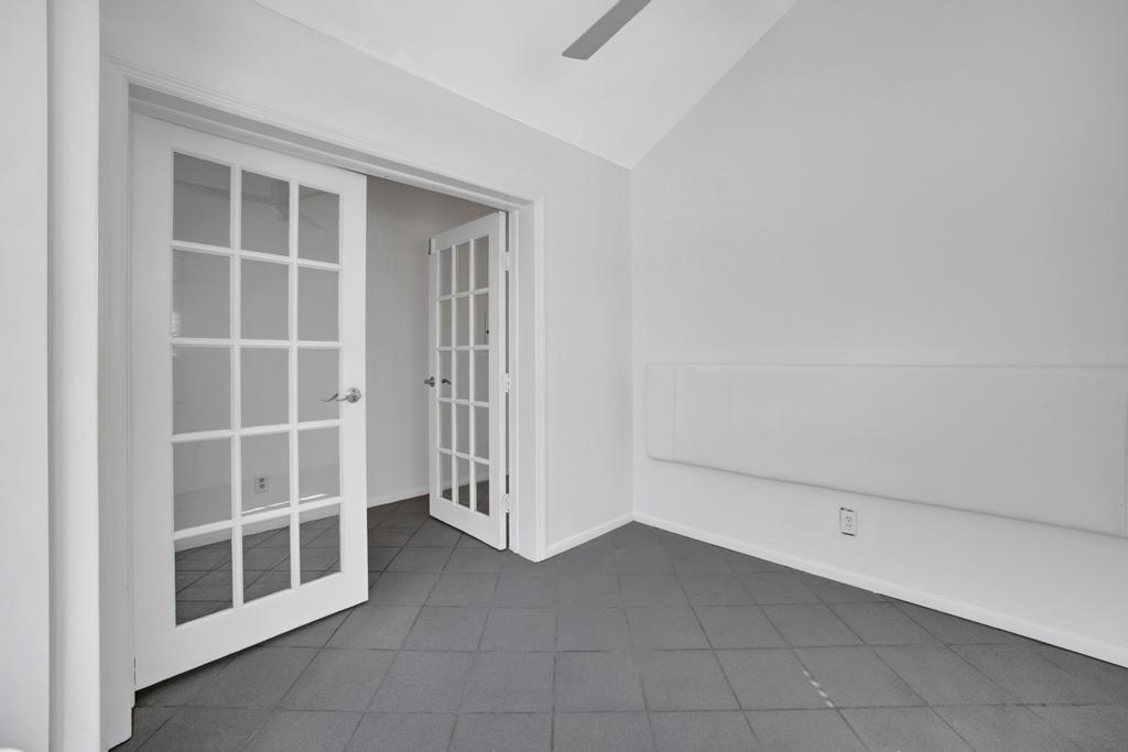623 Thomas Street, Unit C Key West, FL 33040 - Photo 12 of 25 a view of an empty room with a window