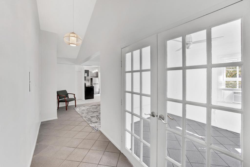 623 Thomas Street, Unit C Key West, FL 33040 - Photo 14 of 25 a view of an entryway with wooden floor
