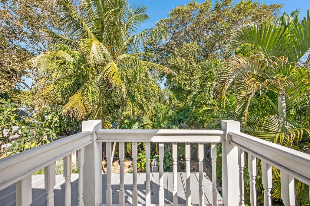 623 Thomas Street, Unit C Key West, FL 33040 - Photo 19 of 25 a view of a wooden fence and floor