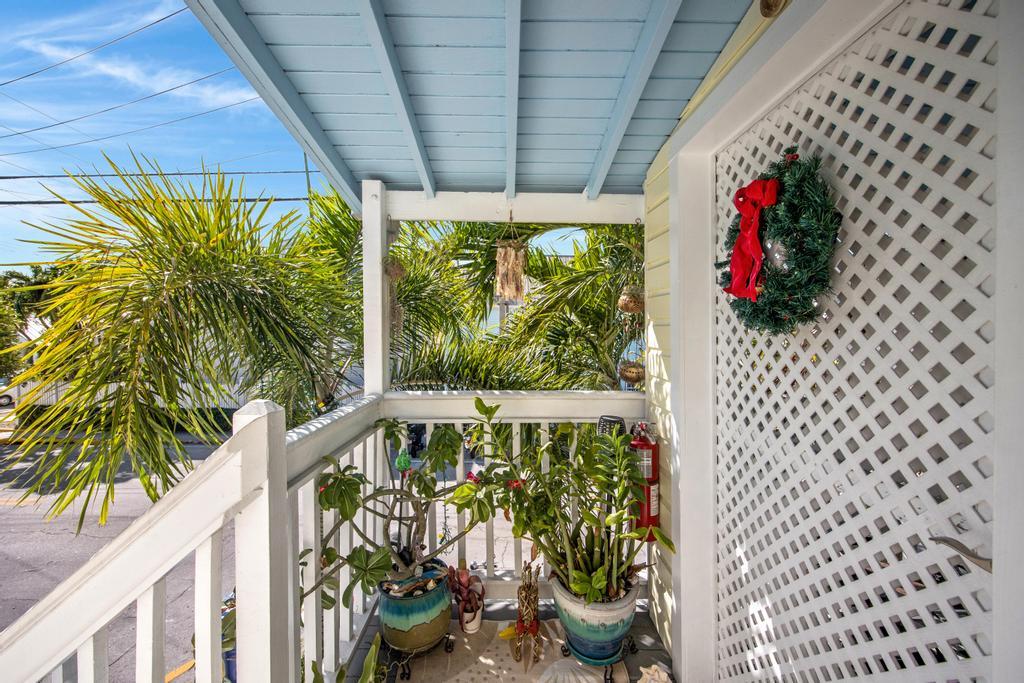 623 Thomas Street, Unit C Key West, FL 33040 - Photo 24 of 25 a front view of a house with wooden floor
