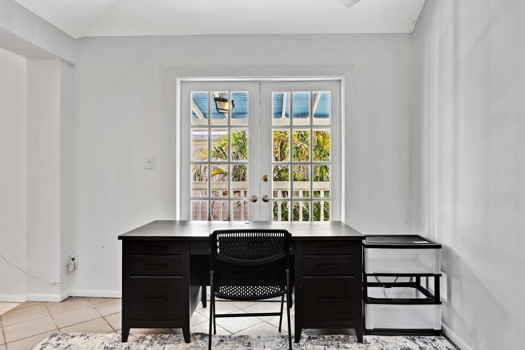 623 Thomas Street, Unit C Key West, FL 33040 - Photo 4 of 25 a view of a workspace room with furniture and a window